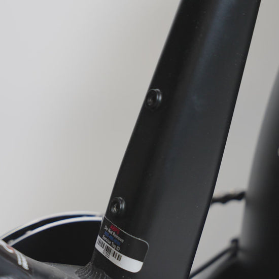 Showing how to install the air tag holder without and without the water bottle cage  and showing what the air tag holder looks like.