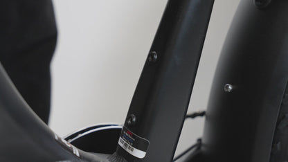 Showing how to install the air tag holder without and without the water bottle cage  and showing what the air tag holder looks like.